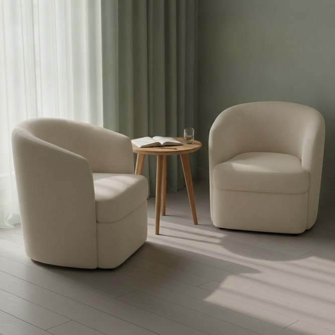 A warm, softly lit consultation room at Southwest Plastic Surgery in El Paso with two chairs facing each other, a small round table and a notepad, illustrating a patient conversation.