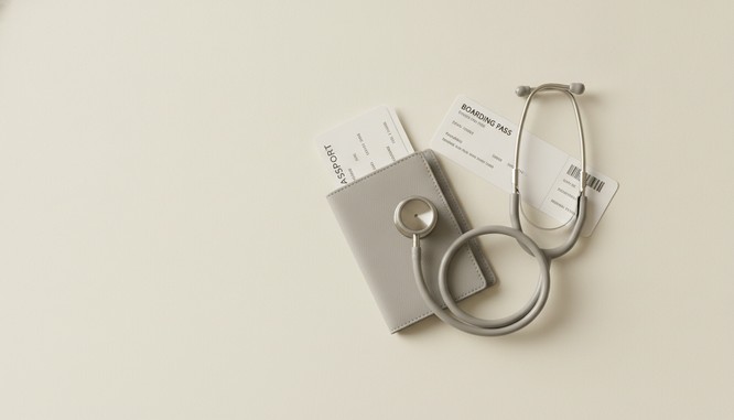 Color photograph of a passport and boarding pass beside a stethoscope at Southwest Plastic Surgery in El Paso. Medical tourism safety guidance from Frank Agullo, MD, FACS.